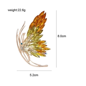 Elegant 3D butterfly brooch with golden crystals and diamonds measuring 8.0x5.2cm