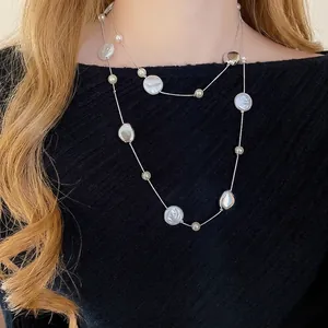 French vintage acrylic pearl and silver metal disc beaded necklace on black sweater