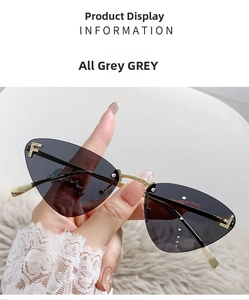 Detail of rimless cat-eye sunglasses with grey lenses and crystal F-letter ornaments