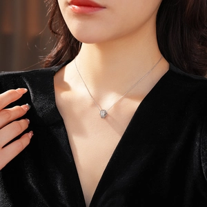 Close-up of 18K gold plated silver necklace with interlocking double circles and zircons