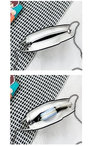 Interior view showing the capacity of the white PU leather crossbody bag with chain strap