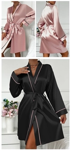 Detail view of satin bathrobes in pink and black colors with elegant contrast piping