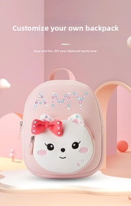 Close-up of pink DIY backpack for girls with personalized rhinestone AMY name tag