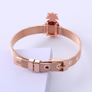 Rose gold mesh bracelet featuring a sparkling pineapple charm and adjustable buckle clasp