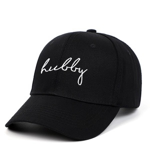 Classic black cotton baseball cap featuring white Hubby embroidery on a soft top crown