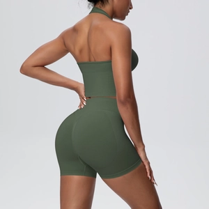 Detail of olive green ribbed yoga set showing halter top and high waist shorts from the side