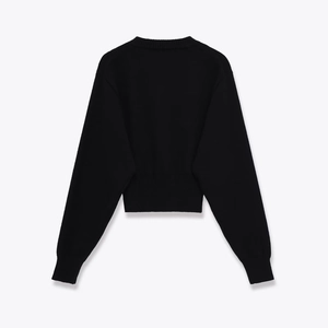 Women's minimalist slim fit black crew neck long sleeve knit sweater in cropped design