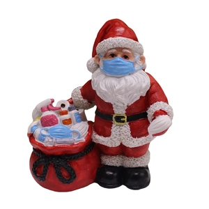 Figurine du Père Noël avec masque médical et accessoires de santé pour décoration