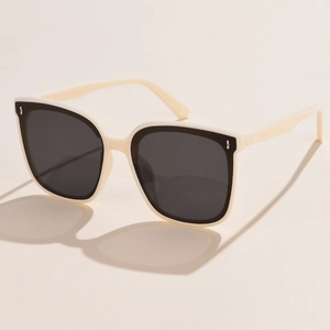 Retro polarized sunglasses with cream frames and black lenses shown from 45-degree angle