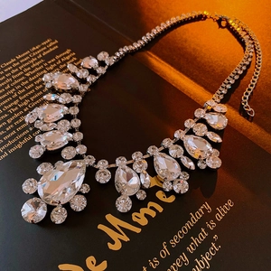 Detail of teardrop crystal necklace with lobster clasp and adjustable metal chain extension