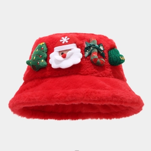 Detail showing plush Christmas bucket hat with festive Santa and tree ornaments