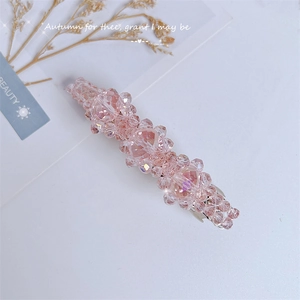 Pink crystal beaded hair clip with automatic spring buckle shown on a white aesthetic background