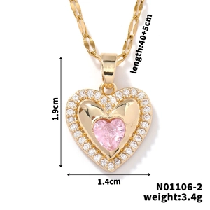 Detail view of heart pendant necklace with dimensions 1.9x1.4cm and pink zircon