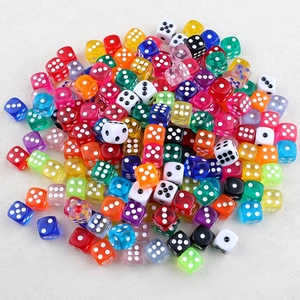 Close-up of colorful acrylic dice assortment for DIY keychain and jewelry making