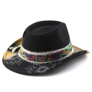 Detail of black wool fedora featuring white floral art and colorful paisley ribbon trim