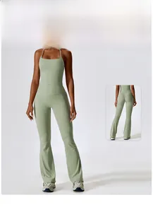 Detail of cross-back yoga tank top and flare leggings set with lifting seam in sage green