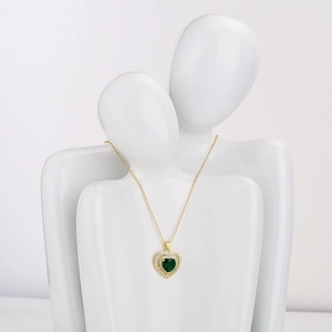 18K gold plated heart necklace with green zircon and clear stones on white bust model