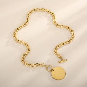 Polished gold stainless steel O-chain necklace with OT buckle and blank round tag detail