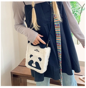 Detail of cute plush panda crossbody bag with colorful strap and HIS PANDA embroidery