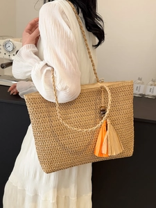 Women's large straw tote bag with rainbow stripes and tassel for beach vacations