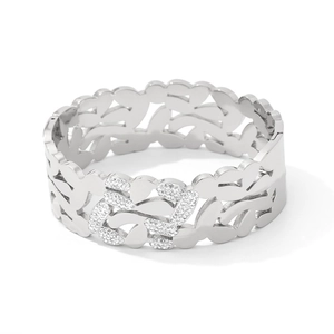Polished silver stainless steel bangle with hollow leaf patterns and white zircon stones