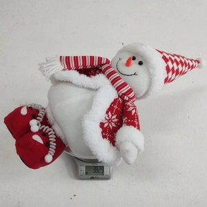 Detailed view of plush Christmas snowman weight measurement showing 382.9g on digital scale