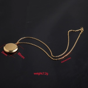 Golden 316L stainless steel oval locket necklace with mirror finish on black background