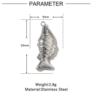 Macro detail of fish-shaped stainless steel pendant with scale texture and 24mm dimension