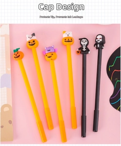 Detail of Halloween gel pens with pumpkin and ghost toppers and protective cap design