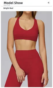 Detail of red brushed yoga bra and high waist leggings fabric texture on model