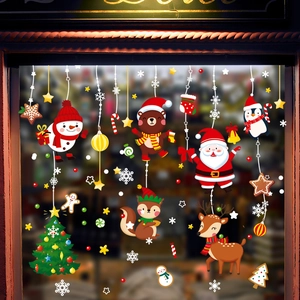 Christmas window decals with Santa Claus, reindeer and snowman on a glass pane