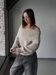 Chic beige off-shoulder knit sweater featuring lantern sleeves and a vertical ribbed collar