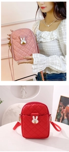 Detailed view of pink and red quilted crossbody bags with bunny hardware buckle