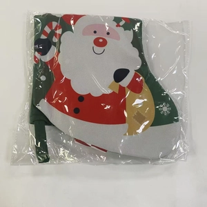 Detail of Christmas stocking with cartoon Santa Claus in clear packaging for holiday gifts