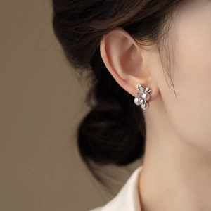 Elegant floral pearl stud earrings with silver plating and sparkling diamond accents