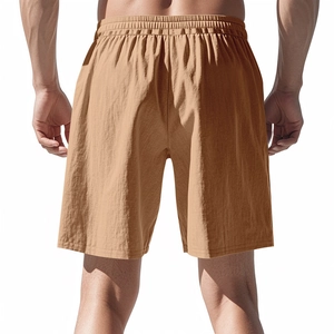 Rear view of light brown linen shorts for men with elastic waistband and textured fabric