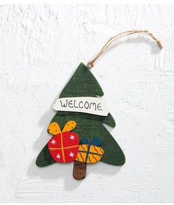 Detail of wooden Christmas tree hanging sign with Welcome text and gift ornaments