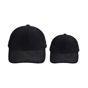 Detailed view of parent-child black corduroy baseball caps in large and small sizes