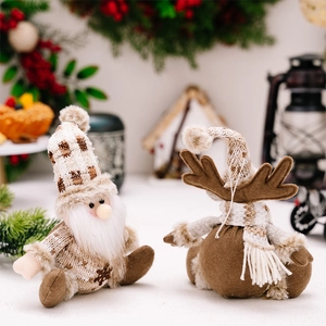 Detailed close-up of knitted Santa and reindeer ornaments with snowflake patterns