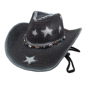 Detail of black straw cowboy hat featuring ethnic turquoise beaded band and chin strap