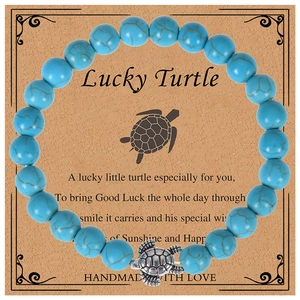 Detail of 8mm amazonite stone bead bracelet with silver turtle charm on card