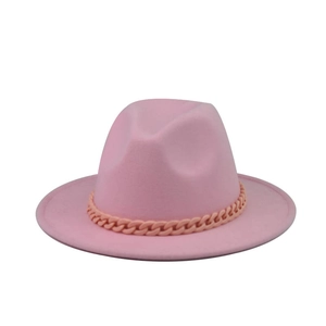 Detailed view of a pink wide brim wool fedora hat with a matching thick chain decoration