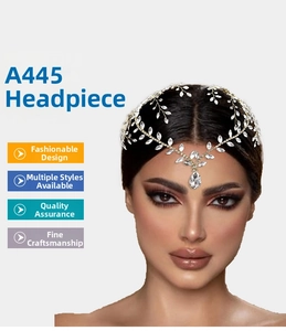 Detail of bohemian gold leaf headpiece with sparkling rhinestones and teardrop pendant