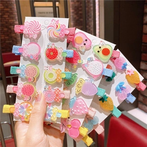 Detail of colorful acrylic hair clip set featuring cute fruits and dessert designs