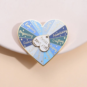 Rotating rainbow heart enamel pin with self-care activities and gold finish