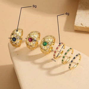 Luxurious gold geometric open rings with colorful zircon inlay on beige stand