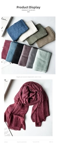 Detailed close-up showing soft cotton linen scarves in various colors and striped textures