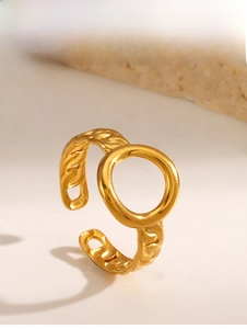Detail of gold-plated open ring featuring a hollow round center and Cuban chain texture
