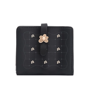 Close-up of black PU leather wallet featuring floral print and 3D metal flower clasp