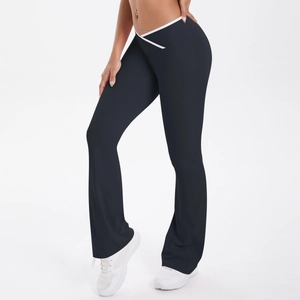 Detail of high waist yoga flare pants featuring white V-shape crossover contrast waistband